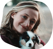 Dr Hannah outdoors with her dog Bosley