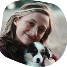 Dr Hannah outdoors with her dog Bosley
