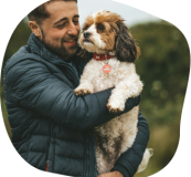 Dr Matt holding his dog Max