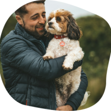 Dr Matt holding his dog Max
